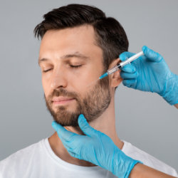 A middle-aged man getting facial injections.