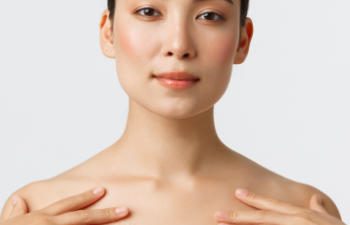 Asian woman with perfect skin after cosmetic treatment.